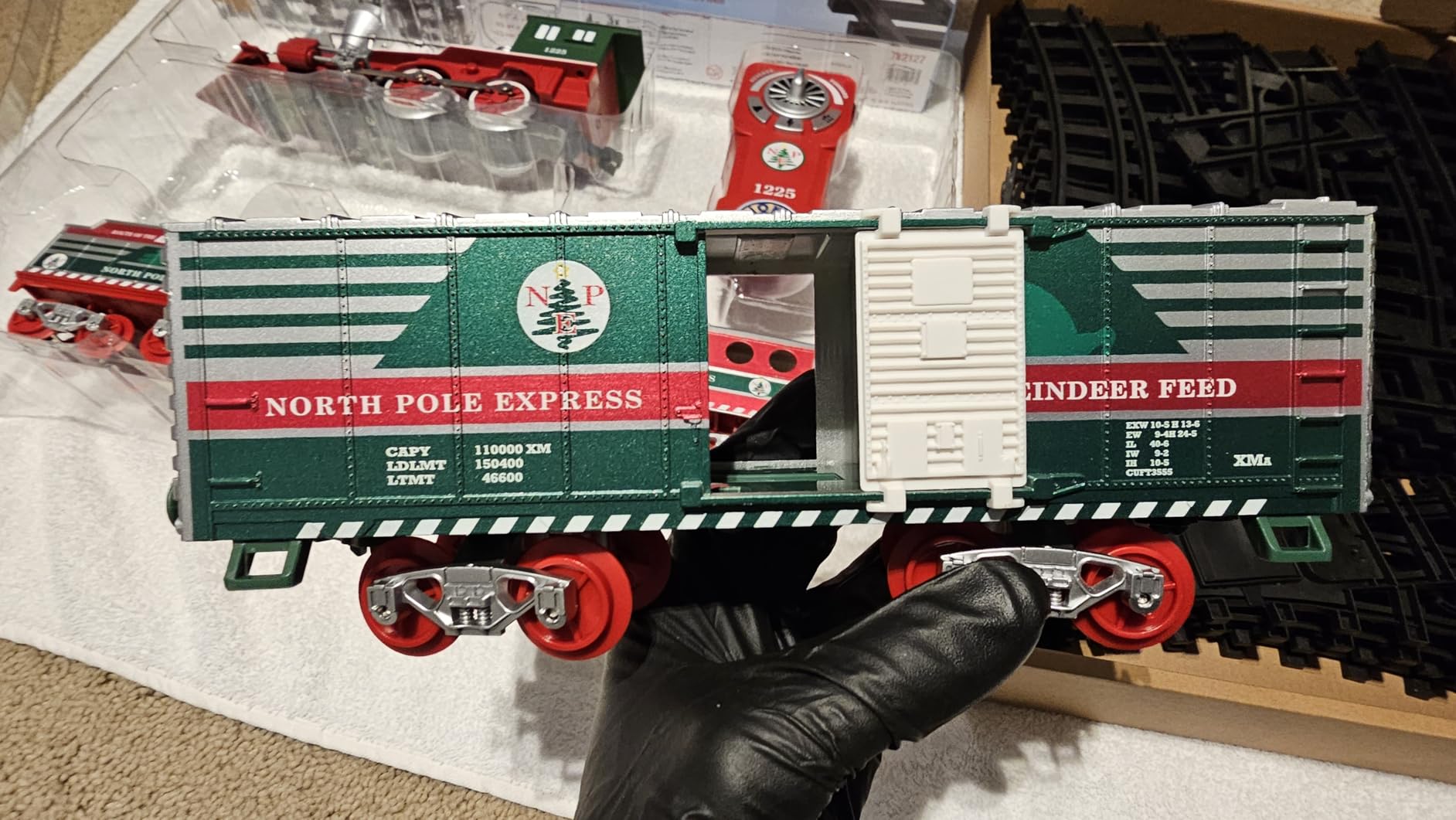 Lionel North Pole Express Battery O Gauge Toy Train Set with Remote, Locomotive, Train Cars, & Track with Authentic Train Sounds, Lights, & Water Vapor Smoke Effects for Kids 4+ customer photo 1