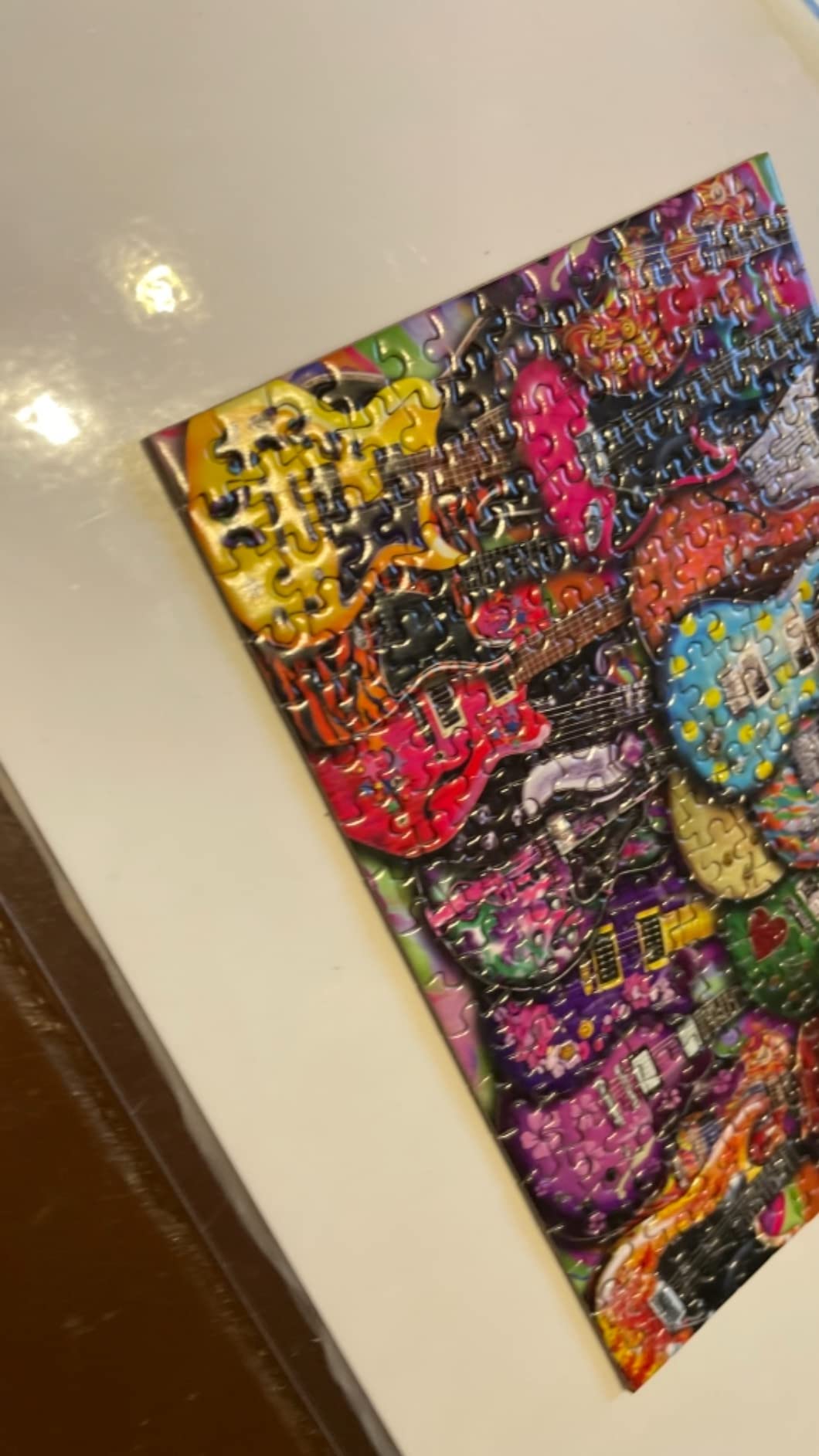 TDC Games World's Smallest Jigsaw Puzzle, Six String Fling - Mini Puzzles, Small Challenging Travel Art Puzzle for Adults, 200+ Pieces, 6 x 4 inches customer photo 1