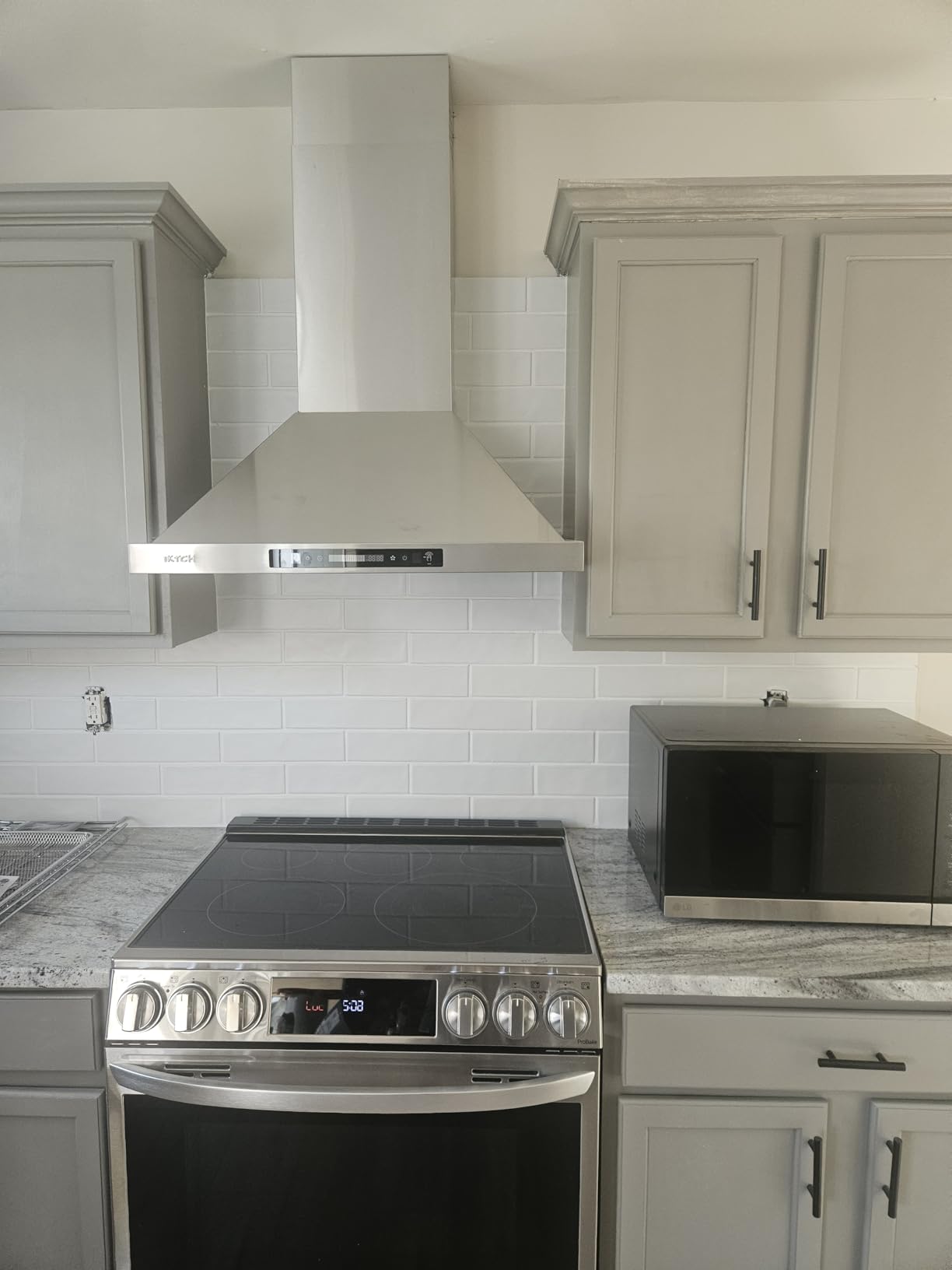 IKTCH 30-inch Wall Mount Range Hood 900 CFM Ducted/Ductless Convertible, Kitchen Chimney Vent Stainless Steel with Gesture Sensing & Touch Control Switch Panel, 2 Pcs Adjustable Lights (IKP02-30) customer photo 2