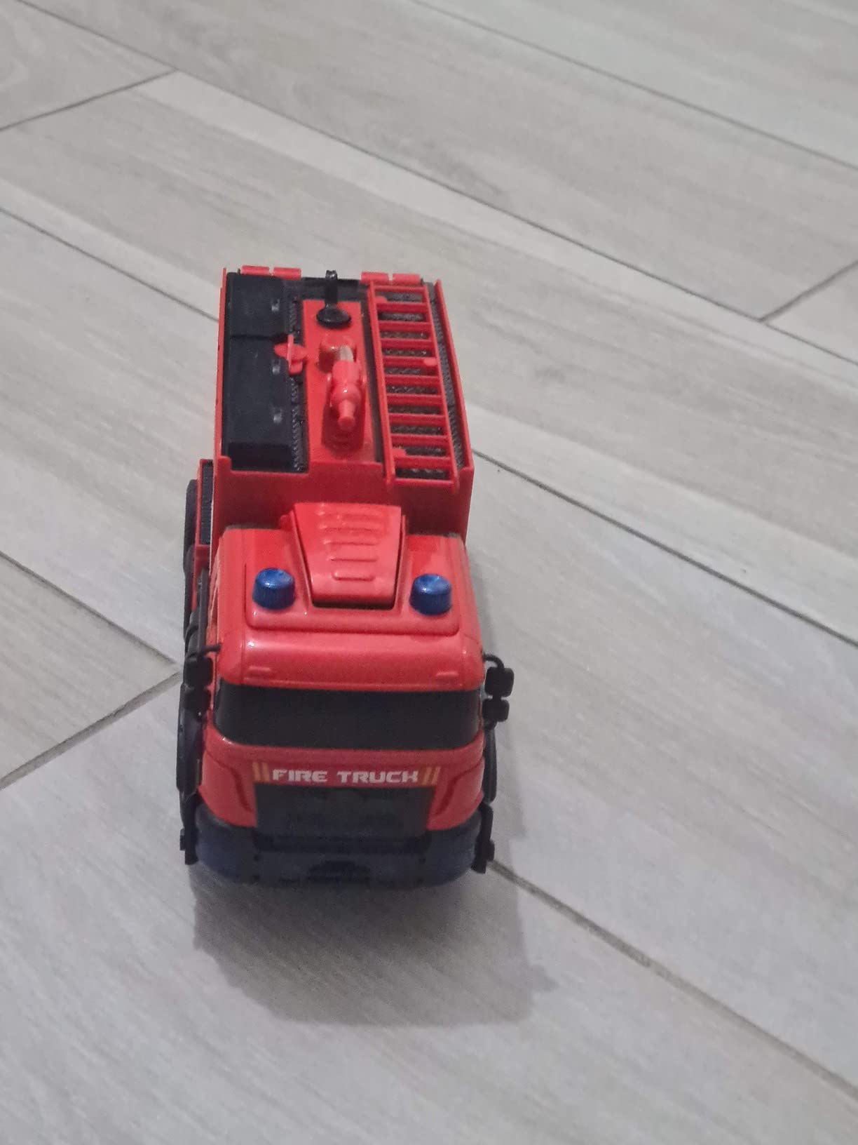 Grarain Remote Control Fire Truck with LED Sounds, RC Car Toy with 3pcs Small Firetrucks and 10pcs Roadblock Models, One Button Press Spraying Water Transformer Fire Truck for Kids Toddlers Boys customer photo 2