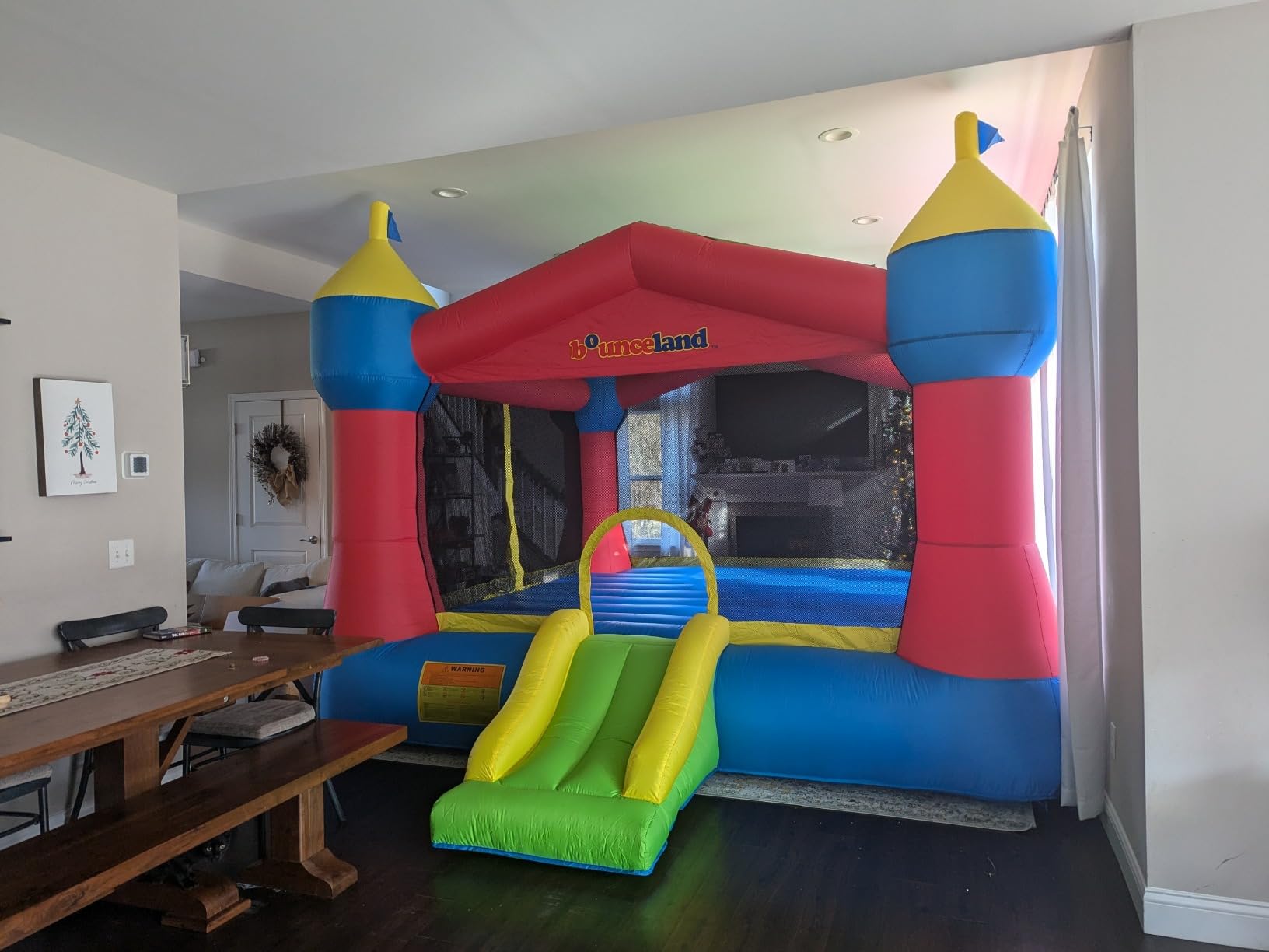 Bounceland Inflatable Party Castle Bounce House Bouncer, 16 ft L x 13 ft W x 10.3 ft H, Basketball Hoop, Removable Sun Roof, UL Strong Blower included, Fun Slide and Bounce Area, Castle Theme for Kids customer photo 2