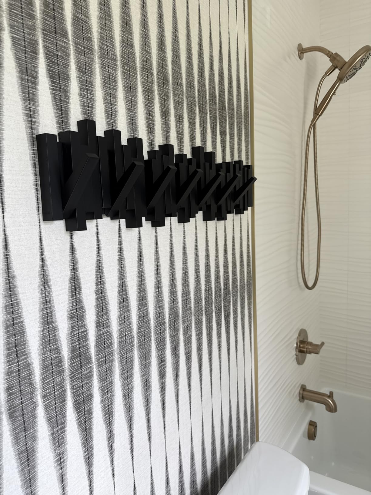 Umbra Sticks Wall Mount Coat Rack, 5 Hook Retractable Pegs, Black customer photo 2