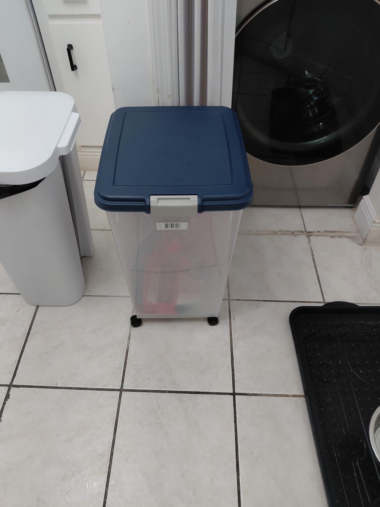 IRIS USA Airtight Pet Food Storage Rolling Container, 30 lb Capacity, Black | Airtight seal keeps kibble, bird seed, and pet food fresh while wheels provide easy mobility around the home. customer photo 1