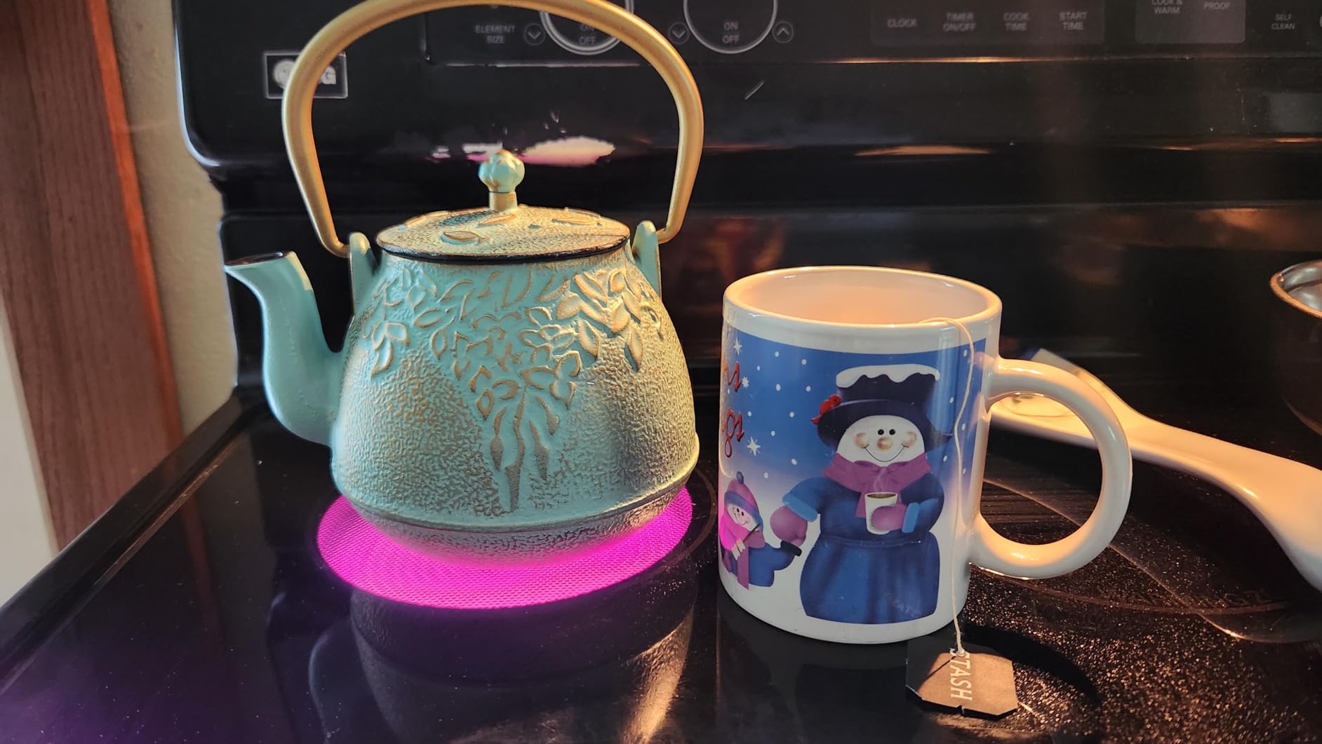 Toptier Mini Little Teapot, Super Small Cast Iron Teapot for Stove Top, Palm-Sized Japanese Stovetop Safe Tea Kettle with Infuser for 11 oz, Black customer photo 2