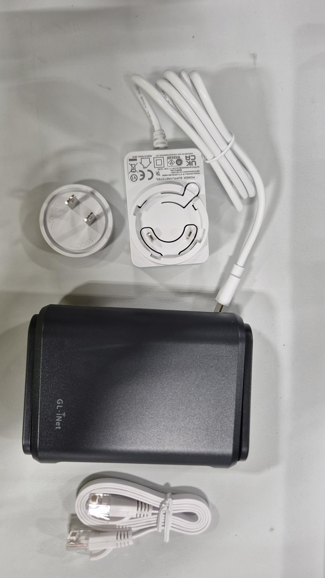 GL.iNet GL-A1300 Pocket VPN Travel Router - Portable Wi-Fi Router for Travel, Easy to Set up, Connect to Public & Hotel Wi-Fi login Page | Built-in VPN client and server for 30+ providers, AdGuard Home ready for ad blocking, repeater mode for hotel and RV Wi-Fi customer photo 1