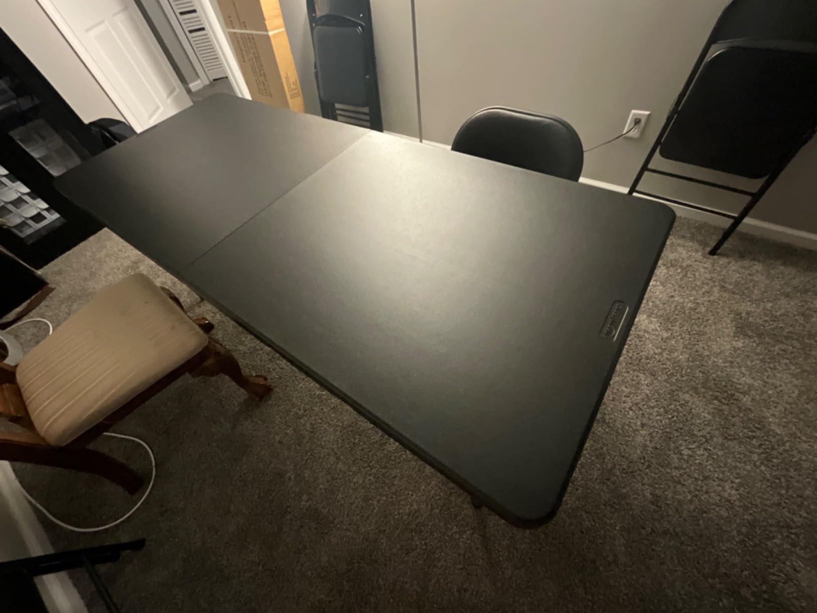 Amazon Basics Heavy Duty Portable Folding Table, 6 ft, Indoor & Outdoor, Fold-in-Half Design with Carrying Handle, for Events, Easy Folding and Storage, Black customer photo 2