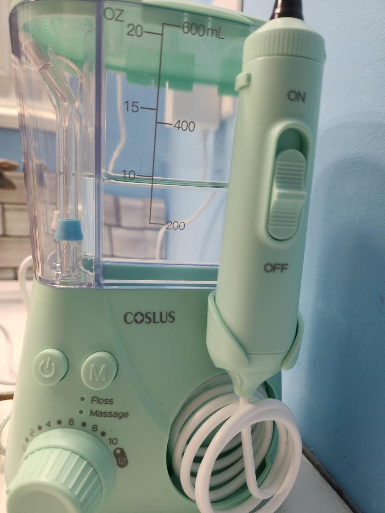 COSLUS E2 Water Dental Flosser for Teeth Cleaning, Multi-User Family Use | 12 Pressure Settings & 2 Modes for Orthodontic, Braces, Sensitive, Patented Storage, 5 Jet Tips and 600ML Tank Home, Green customer photo 1