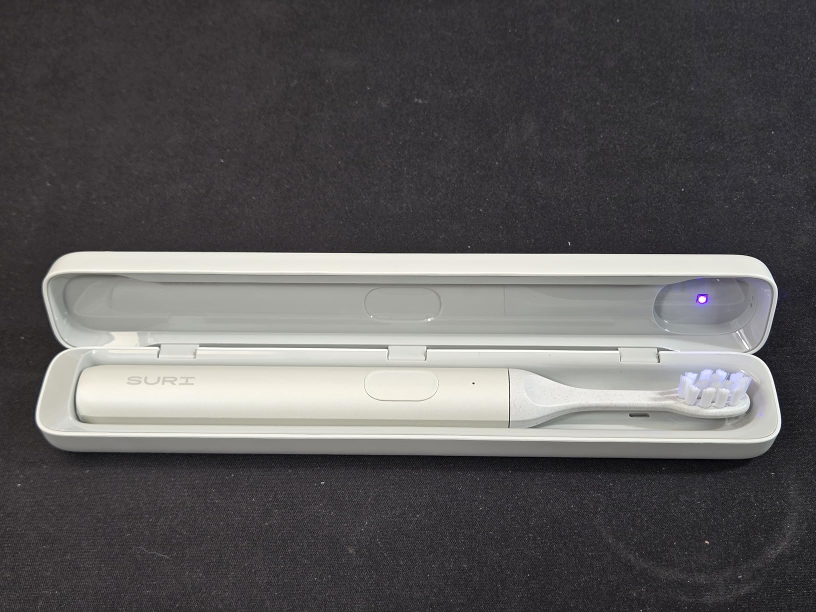 SURI Pro Sonic Electric Toothbrush | Over 4+ Weeks Battery | UV Cleaning Travel Case | Pressure Sensor | Aluminium Body | 2-Minute Timer | Plant-Based Heads | Green customer photo 1