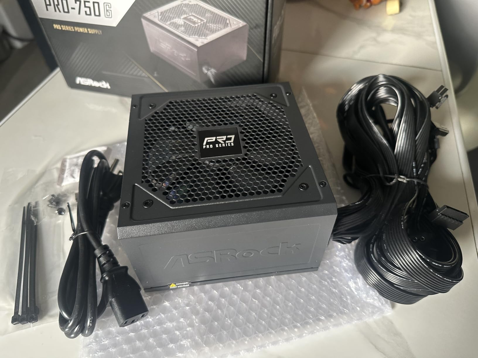ASRock PRO 750G Power Supply - 750W 80 Plus Gold Certified, ATX 3.1 & PCIe 5.1 Ready, Native 12V-2x6 Connector, 120mm Low-Noise Fan, 3-Year Warranty customer photo 1