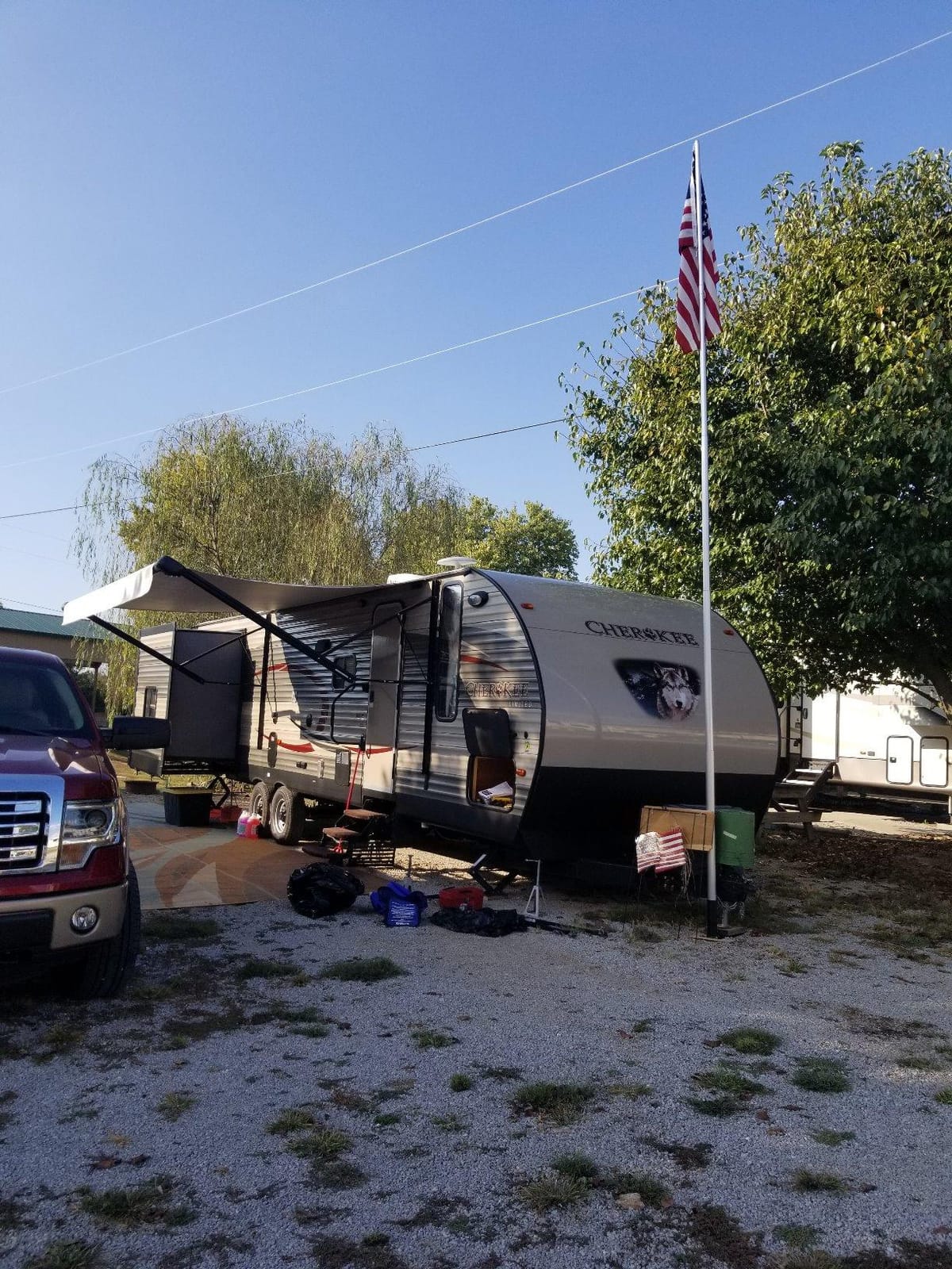 Camco Telescoping Camper/RV Flagpole Kit - Features Adjustable Pole Height Extends to 20-Ft & Collapses to 65-In - Includes Tire-Anchored Flagpole Holder, Storage Bag & 3’ x 5’ American Flag (51600) customer photo 1